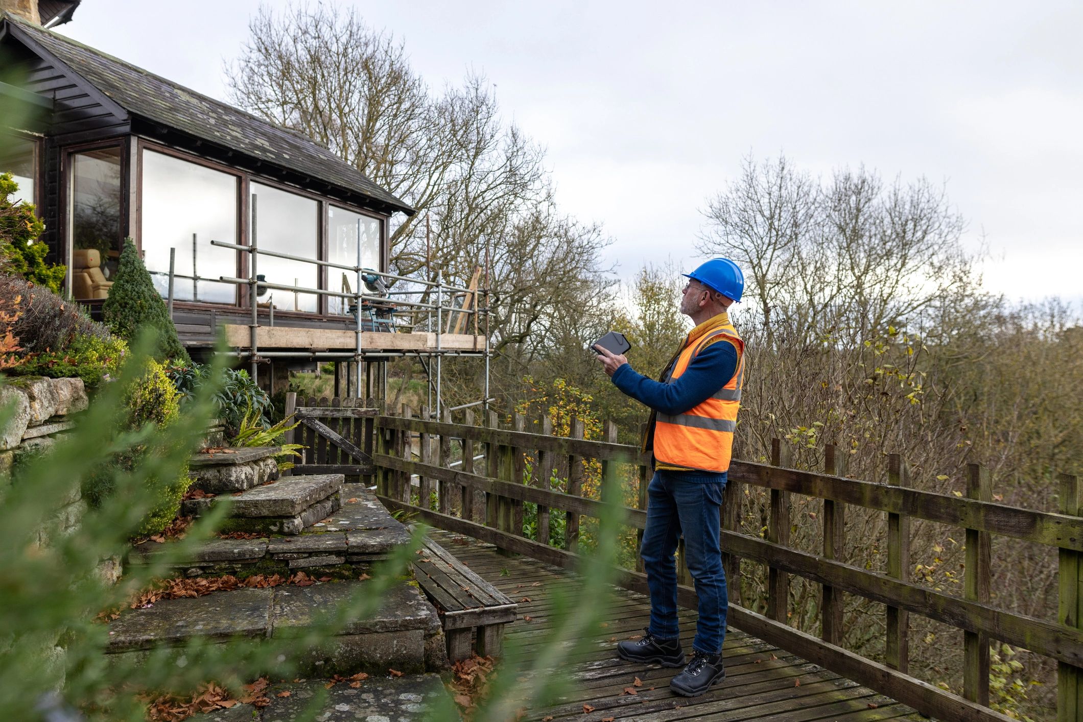 Environmental professional conducting a site assessment with drone support